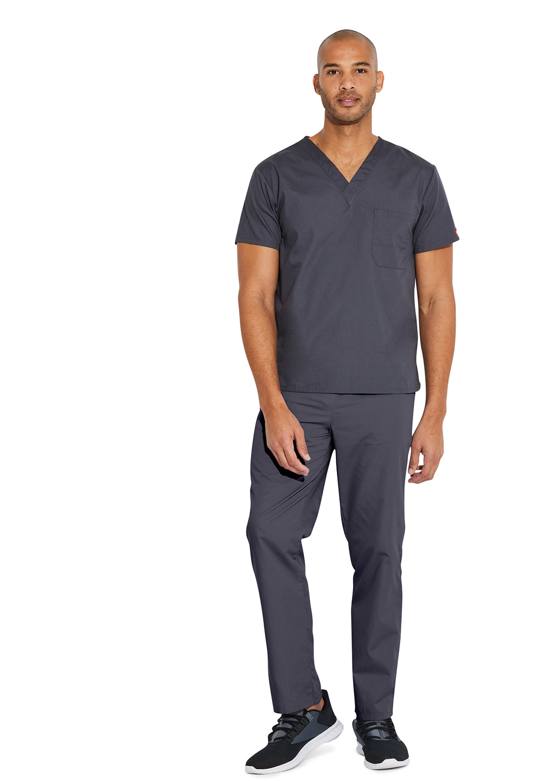 Unisex top met V-hals die in de broek gedragen kan worden met borstzak en zijsplitten