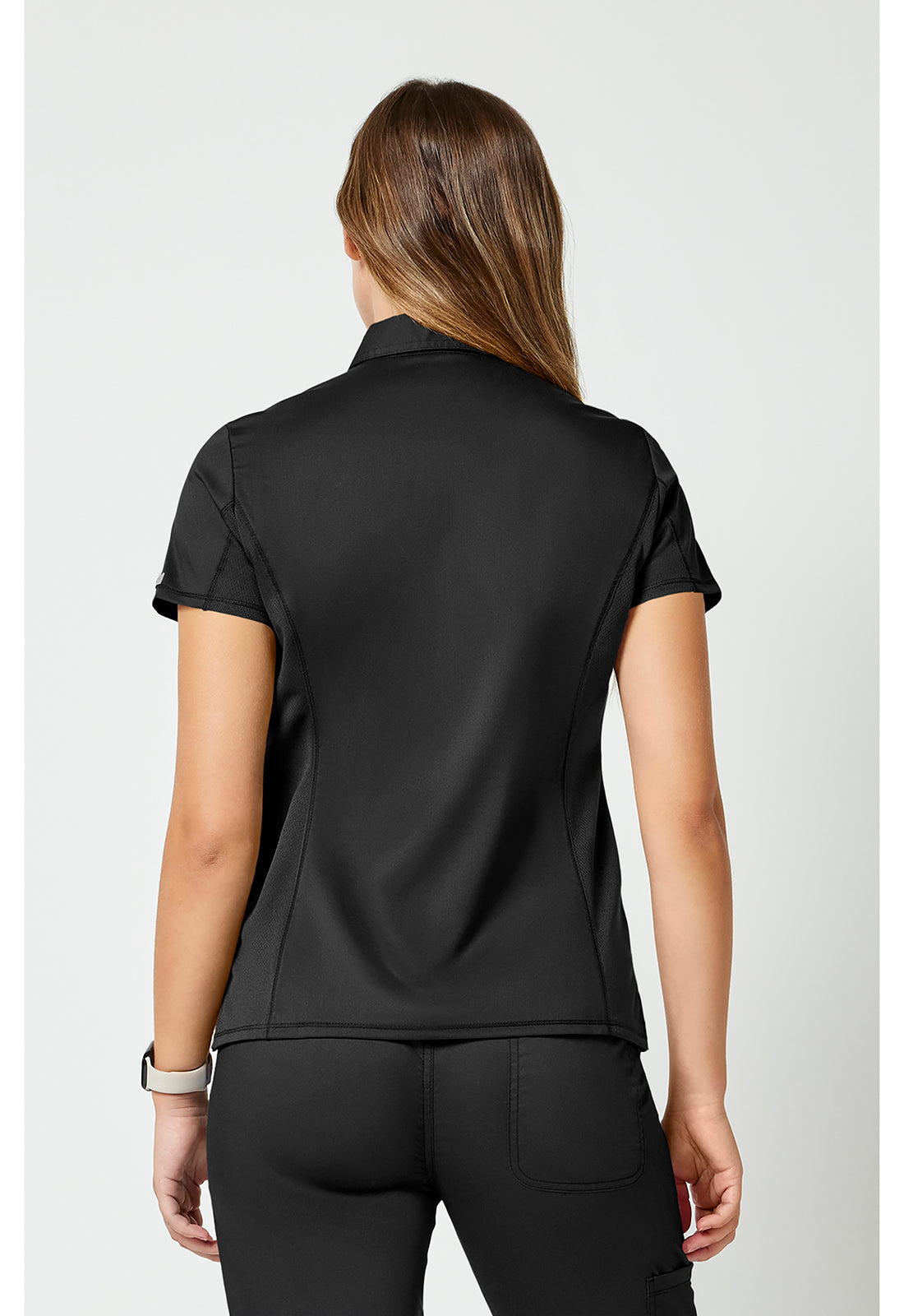 Instopbare polo met drukknoopsluiting aan de voorkant met meshpanelen en 2-way stretch WWE698