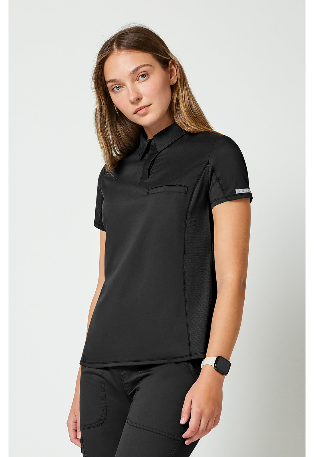 Instopbare polo met drukknoopsluiting aan de voorkant met meshpanelen en 2-way stretch WWE698
