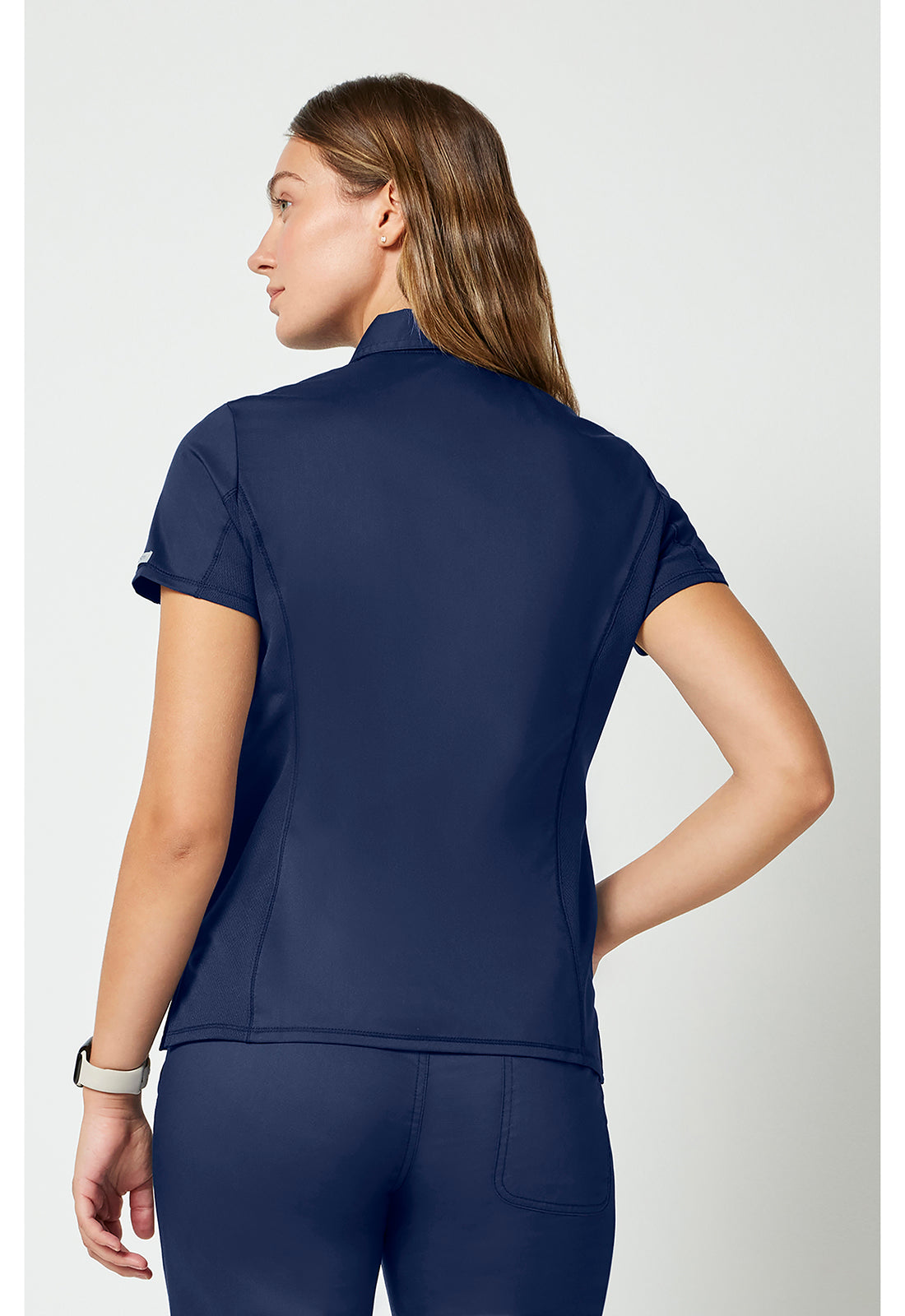Instopbare polo met drukknoopsluiting aan de voorkant met meshpanelen en 2-way stretch WWE698